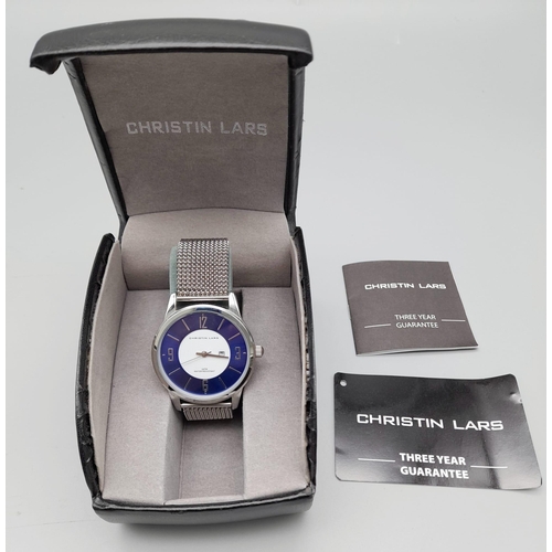 774 - Ex Display Christin Lars Stainless Steel Date Quartz Watch. Blue and White Dial, Expanding Strap, 42... 