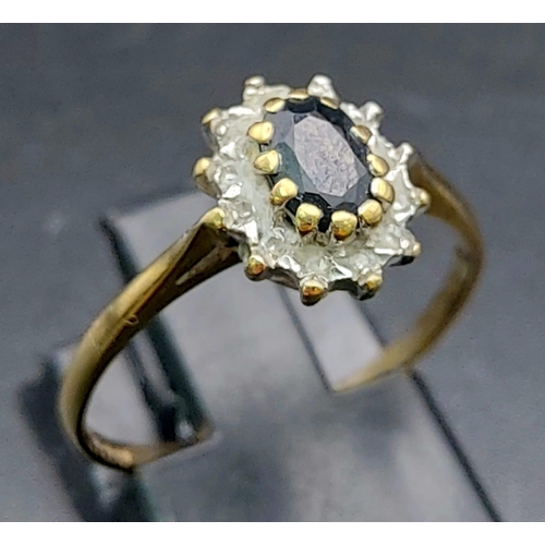 812 - 9K YELLOW GOLD DIAMOND & SAPPHIRE CLUSTER RING. TOTAL WEIGHT 1.6G SIZE N 1/2