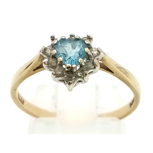 610 - 9K YELLOW GOLD DIAMOND & BLUE TOPAZ HEART SHAPED RING. TOTAL WEIGHT 1.6G SIZE P