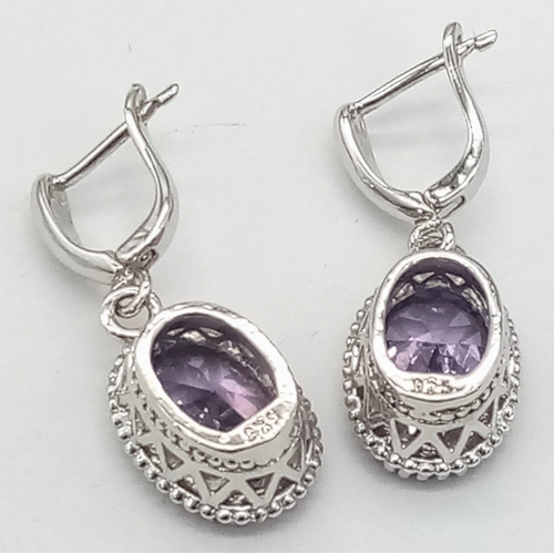 912 - A New Pair of Sterling Silver Crown Mounted Amethyst Set Secure Stud Earrings. Set with 14mm Oval Cu... 