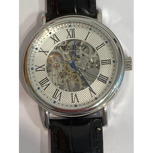 182 - Gentlemans, genuine STUHRLING AUTOMATIC SKELETON WRISTWATCH. Complete with original case, instructio... 