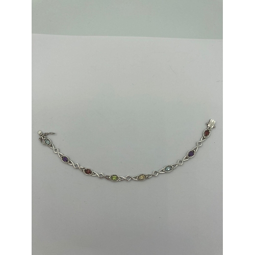 230 - Multi gemstone TENNIS BRACELET having oval cut  TOPAZ, AMETHYST, GARNET, PERIDOT etc, Set and mounte... 