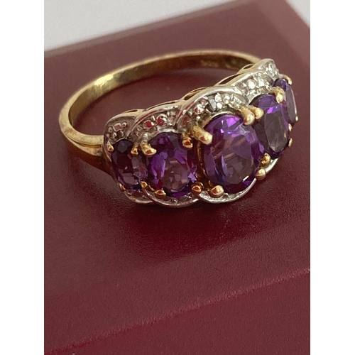 455 - AMETHYST and GOLD VERMEILON RING, Having five Oval cut Amethysts Mounted to top  in a Gold Clad SILV... 