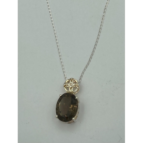 462 - Beautiful oval cut 7.5 carat Brazilian SMOKEY QUARTZ PENDANT. Set in attractive SILVER filigree and ... 