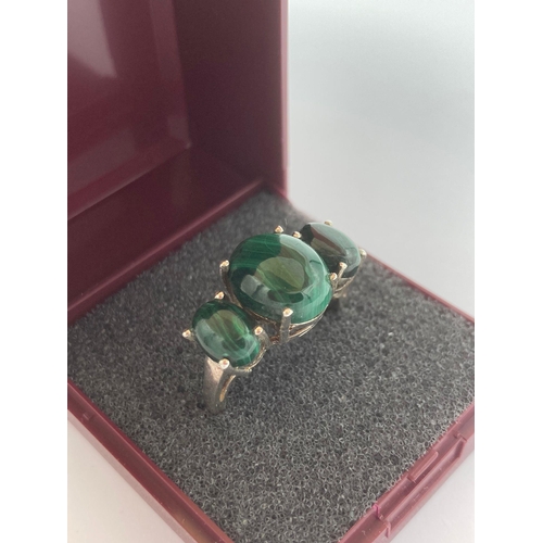 497 - MALACHITE and SILVER RING having three polished malachite stones set to top in SILVER   CRADLE claw ... 