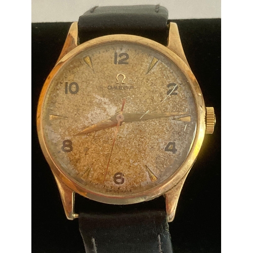 63 - Gentlemans vintage 9 carat GOLD OMEGA WRISTWATCH. Manual winding in full working order. Black leathe... 