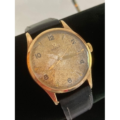 63 - Gentlemans vintage 9 carat GOLD OMEGA WRISTWATCH. Manual winding in full working order. Black leathe... 