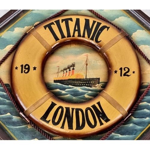 500 - A Vintage Titanic Artwork with Wooden Decorated Life Preserver Attached. In frame - 62 x 62cm.