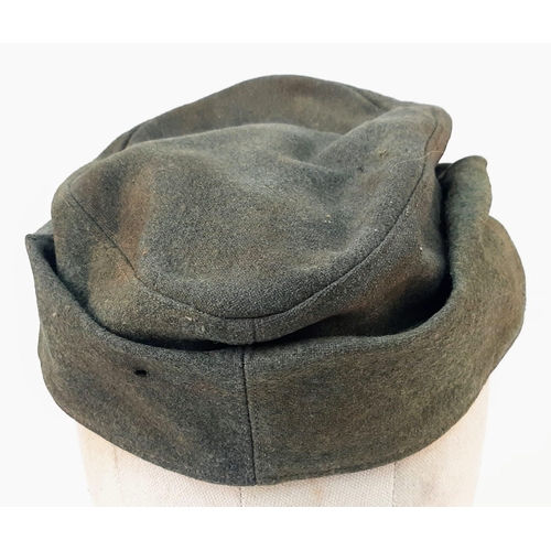 12 - 3rd Reich Waffen SS M43 Ski Cap. Period related small tear on the top. Overall good condition for it... 