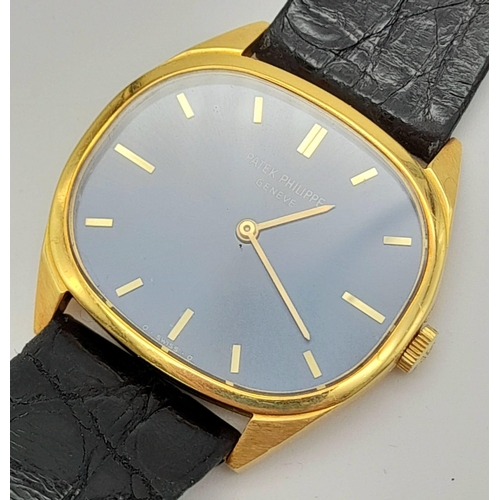 206 - An 18 K yellow gold PATEK PHILIPPE Geneve watch. Case 32 x 28 mm, Blue dial with yellow gold hands a... 