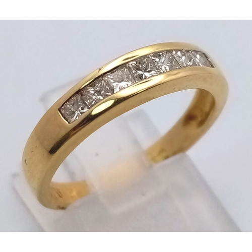 279 - An 18 K yellow gold ring with channel set diamonds (0.30 carats). Ring size: N, weight: 4 g.