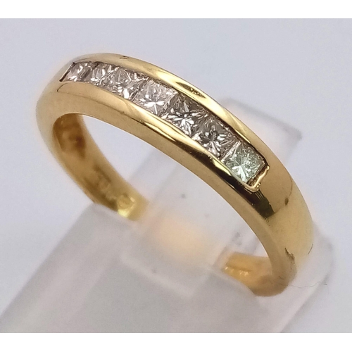 279 - An 18 K yellow gold ring with channel set diamonds (0.30 carats). Ring size: N, weight: 4 g.