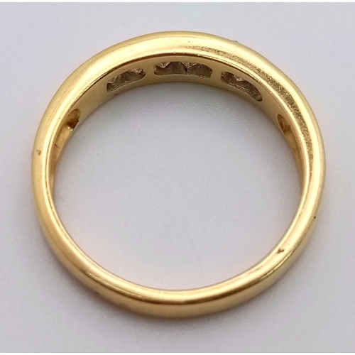 279 - An 18 K yellow gold ring with channel set diamonds (0.30 carats). Ring size: N, weight: 4 g.