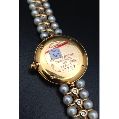 30 - A very feminine CARTIER COLISEE watch. 18 K yellow gold, with a quality genuine pearl strap and a si... 