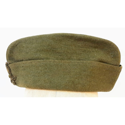 638 - WW2 Italian Officers Side Cap with late post war cap badge.