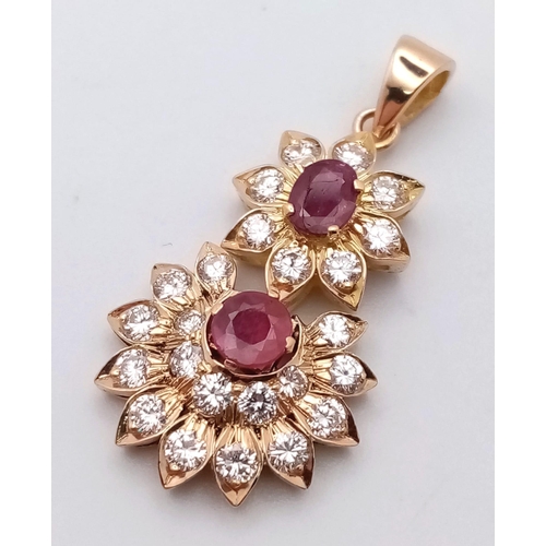 69 - 18K YELLOW GOLD DIAMOND & RUBY DROP PENDANT 1CT APPROX DIAMONDS 0.70CT APPROX RUBIES. TOTAL WEIGHT  ... 