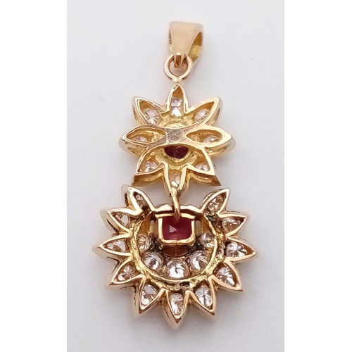 69 - 18K YELLOW GOLD DIAMOND & RUBY DROP PENDANT 1CT APPROX DIAMONDS 0.70CT APPROX RUBIES. TOTAL WEIGHT  ... 