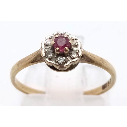 798 - 9K YELLOW GOLD DIAMOND & RUBY CLUSTER RING. TOTAL WEIGHT 1.2G SIZE L