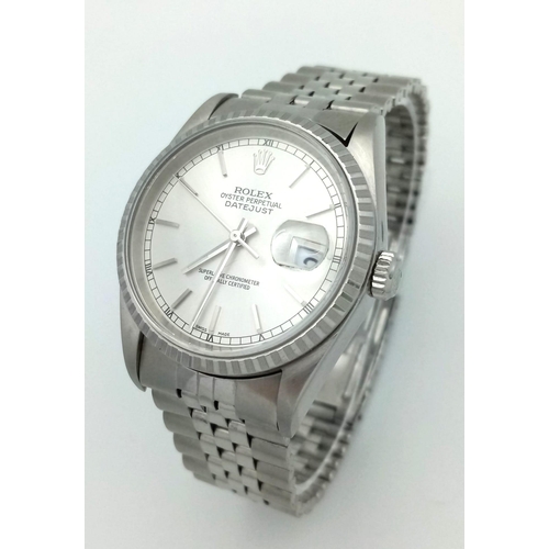 94 - A stainless steel ROLEX OYSTER PERPETUAL DATEJUST watch. Case 36 mm, calibrated bezel, silver tone d... 