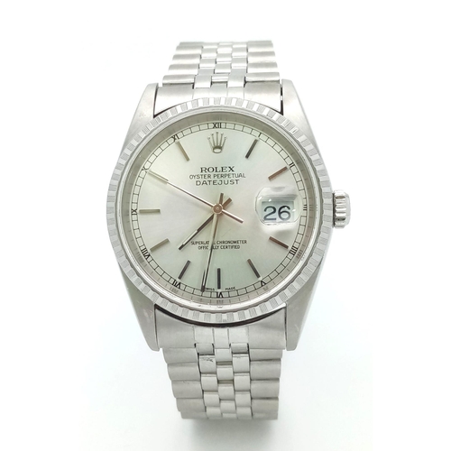 94 - A stainless steel ROLEX OYSTER PERPETUAL DATEJUST watch. Case 36 mm, calibrated bezel, silver tone d... 