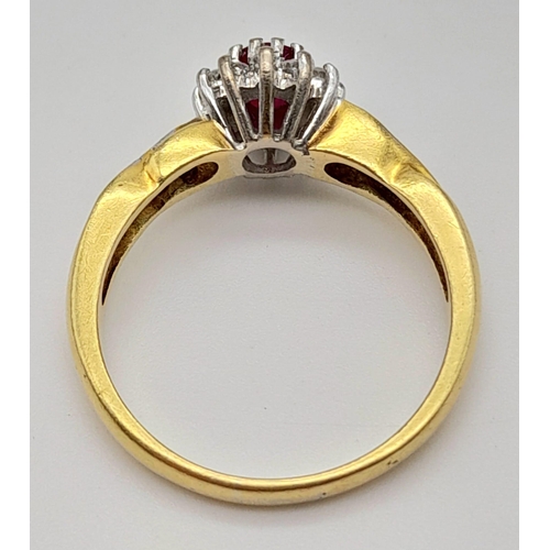 1034 - A Beautiful Vintage 18K Yellow Gold Ruby and Diamond Ring. Central ruby with a diamond halo and a wa... 