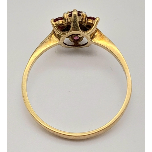 1132 - A Vintage 9K Yellow Gold Ruby and Diamond Ring. Size N. 1.52g.