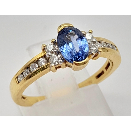 1139 - A 14K Yellow Gold Oval Sapphire and Diamond Ring. Beautiful, fine sapphire with a clean white diamon... 