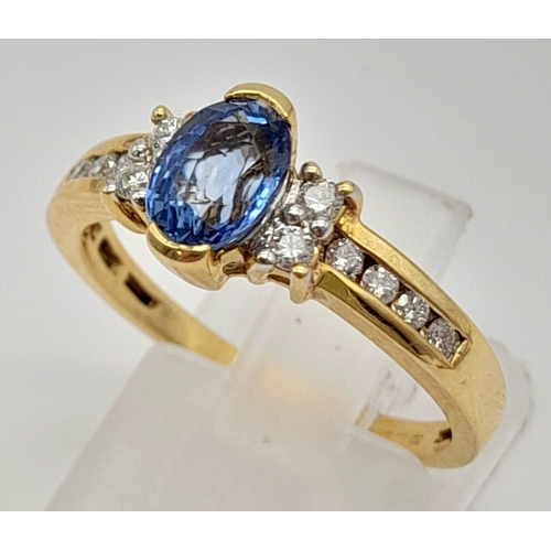 1139 - A 14K Yellow Gold Oval Sapphire and Diamond Ring. Beautiful, fine sapphire with a clean white diamon... 