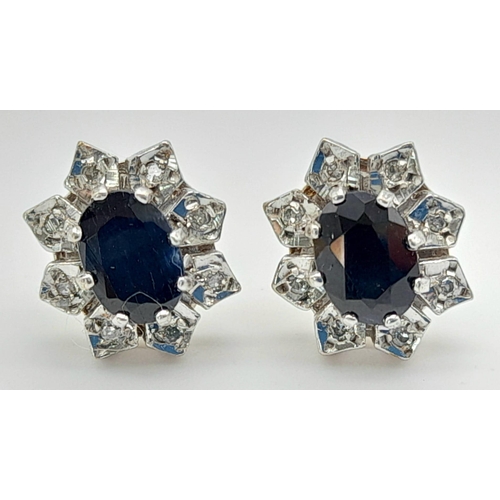 1181 - A Pair of 9K Gold, Sapphire and Diamond Earrings. 2.85g total weight.