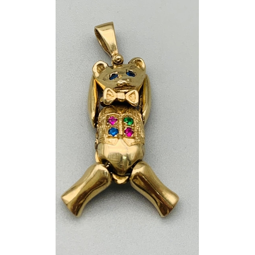 211 - 9k yellow gold articulated gem set teddy bear pendant. Total Weight 8.7g (H:4cm)