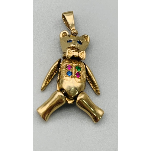 211 - 9k yellow gold articulated gem set teddy bear pendant. Total Weight 8.7g (H:4cm)