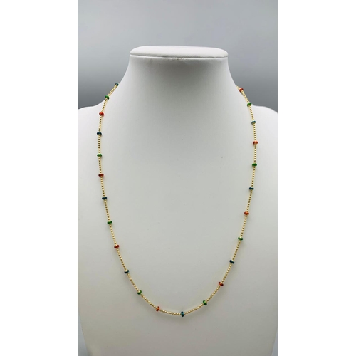 243 - A 14 K yellow gold chain necklace with enamelled parts. Length: 45.5 cm, weight: 4.4 g.