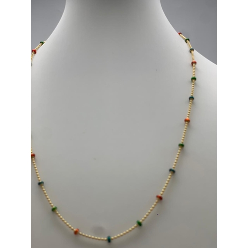 243 - A 14 K yellow gold chain necklace with enamelled parts. Length: 45.5 cm, weight: 4.4 g.