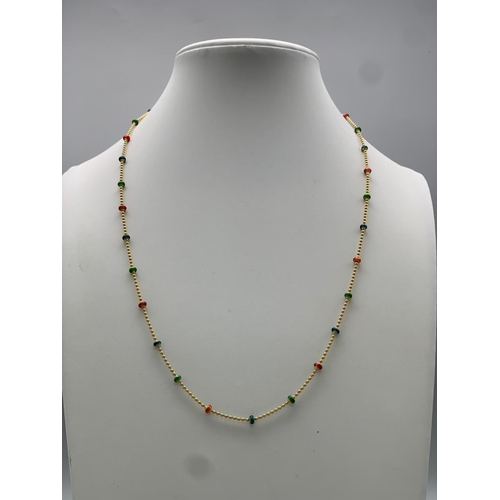 243 - A 14 K yellow gold chain necklace with enamelled parts. Length: 45.5 cm, weight: 4.4 g.