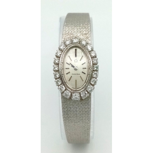 260 - An 18 K white gold OMEGA ladies watch. case: 25 x 17 mm, bezel with round cut diamonds, mechanical m... 