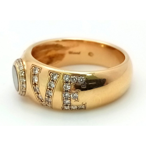 309 - An 18 K yellow gold CHOPPARD ring with diamonds forming the word LOVE  and a floating diamond inside... 