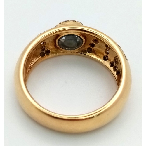 309 - An 18 K yellow gold CHOPPARD ring with diamonds forming the word LOVE  and a floating diamond inside... 