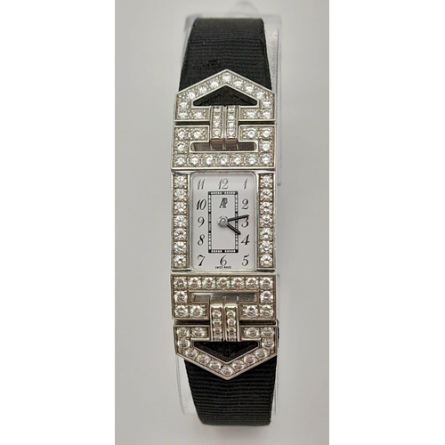 436 - An 18 K white gold and diamonds AUDEMARS PIGUET watch. Case 19 x 14 mm, white dial with Arabic numer... 