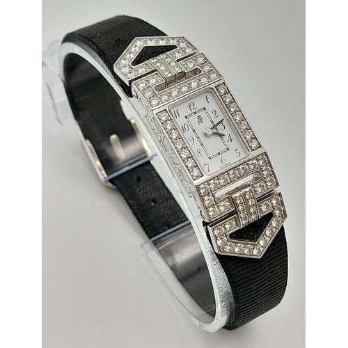 436 - An 18 K white gold and diamonds AUDEMARS PIGUET watch. Case 19 x 14 mm, white dial with Arabic numer... 