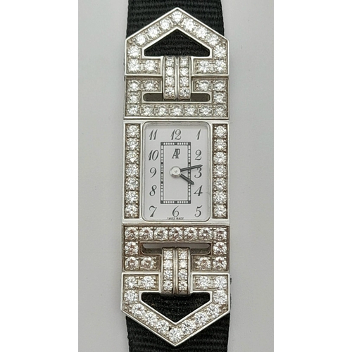 436 - An 18 K white gold and diamonds AUDEMARS PIGUET watch. Case 19 x 14 mm, white dial with Arabic numer... 