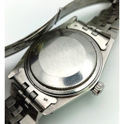 59 - A stainless steel ROLEX OYSTER PERPETUAL DATEJUST watch. Case 36 mm, calibrated bezel, unusual strip... 