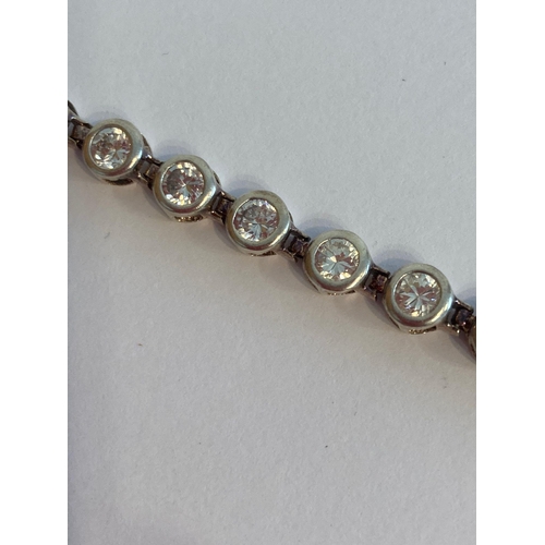 623 - Stunning SILVER TENNIS BRACELET with full UK hallmark. Set with sparkling clear white stones, Each s... 