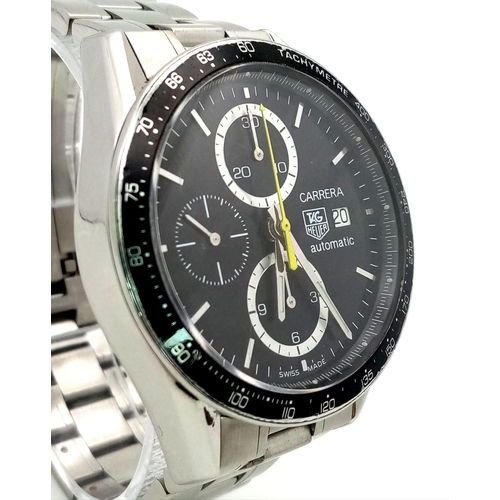 66 - A stainless steel TAG HEUER CARRERA watch. Case 41 mm, black calibrated tachymeter bezel, black dial... 