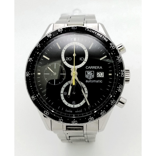 66 - A stainless steel TAG HEUER CARRERA watch. Case 41 mm, black calibrated tachymeter bezel, black dial... 