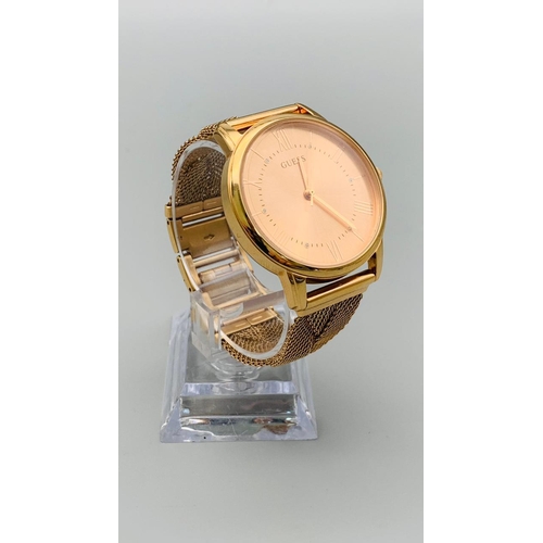 733 - GUESS ROSE GOLD TONE TWIST BRACELET WATCH MAIDEN MODEL REFERNCE W1143L3. FULL WORKING ORDER EXCELLEN... 