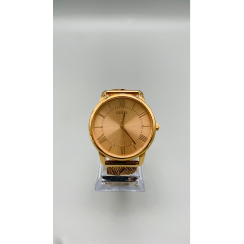 733 - GUESS ROSE GOLD TONE TWIST BRACELET WATCH MAIDEN MODEL REFERNCE W1143L3. FULL WORKING ORDER EXCELLEN... 