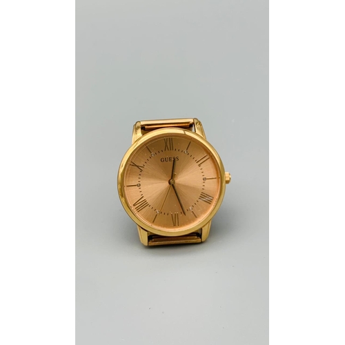 733 - GUESS ROSE GOLD TONE TWIST BRACELET WATCH MAIDEN MODEL REFERNCE W1143L3. FULL WORKING ORDER EXCELLEN... 