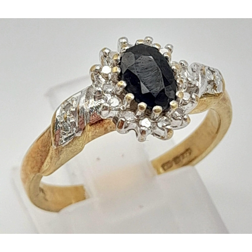 988 - A 9K Yellow Gold Sapphire and Diamond Cluster Ring. Size N. 
3.3g total weight.