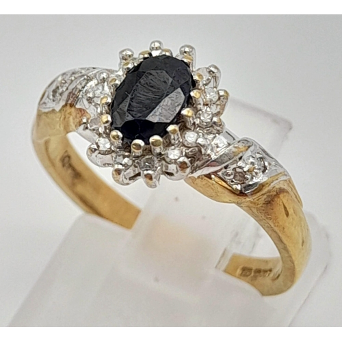 988 - A 9K Yellow Gold Sapphire and Diamond Cluster Ring. Size N. 
3.3g total weight.