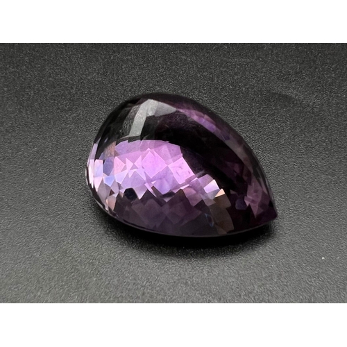 1377 - A 76.50ct Pear Shaped, Bolivian Amethyst Gemstone. Comes with an ITLGR certificate.